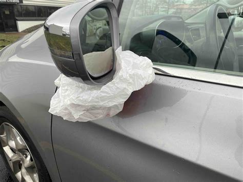 wrap the mirrors with a plastic bag.